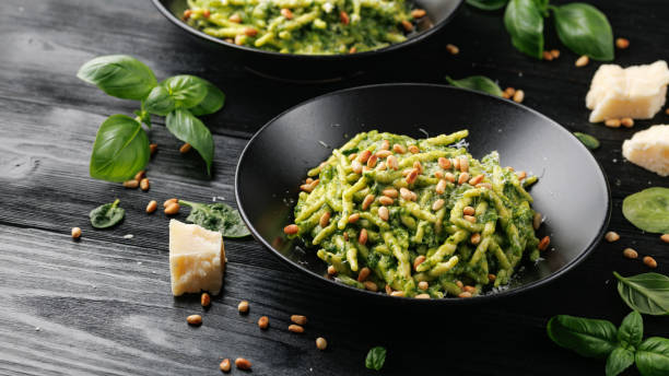 istock Trofie pasta with creamy spinach sauce and toasted pine nuts 2154838741