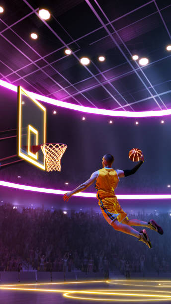 istock Full-length dynamic image of competitive man, basketball player in motion throwing ball into hoop in a jump against neon colored stadium. 2154838882