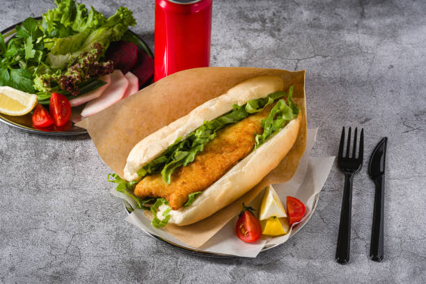 istock Fried fish sandwich with greens on the stone table. Turkish name Balik Ekmek 2154840118