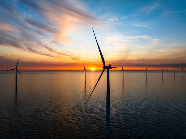 istock Wind turbines in an offshore wind park during springtime seen from above 2154840691