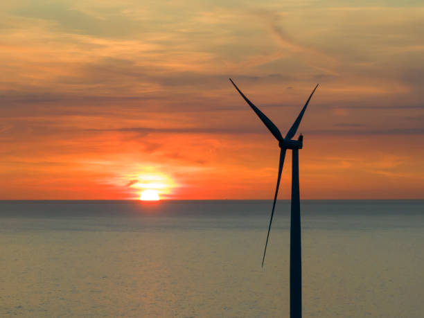 istock Wind turbines in an offshore wind park during springtime seen from above 2154840998