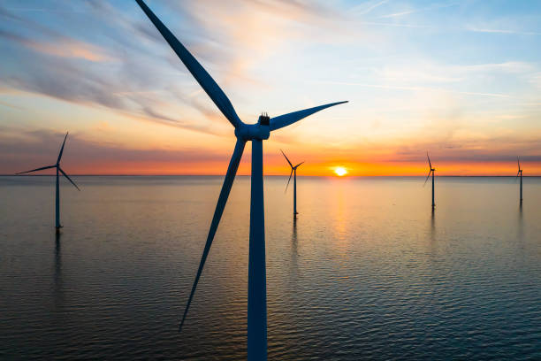 istock Wind turbines in an offshore wind park during springtime seen from above 2154841137