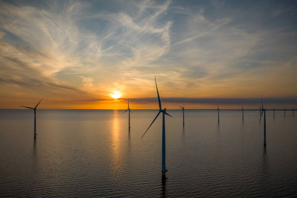 istock Wind turbines in an offshore wind park during springtime seen from above 2154841320