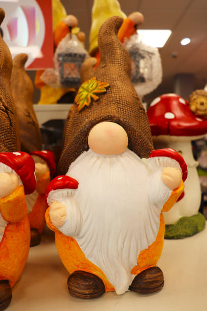 autumn composition. little autumn gnomes with pumpkins