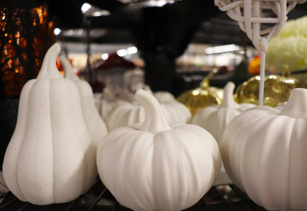 istock little autumn gnomes with pumpkins 2154843780