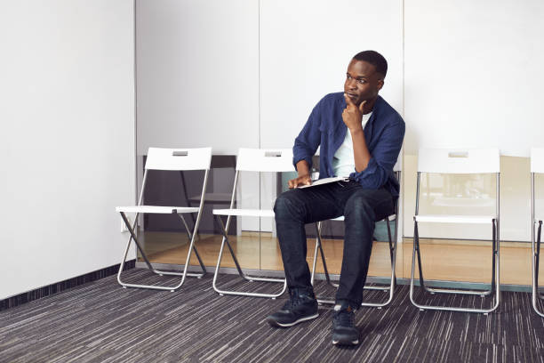 istock Young man candidate waiting for job interview 2154844390