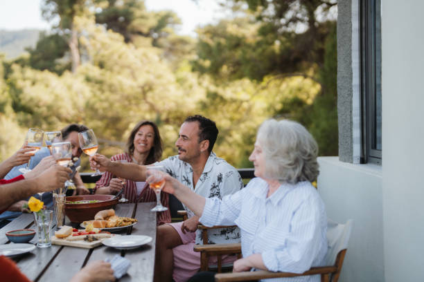 istock Dinner with friends and family on a summer veranda 2154845113