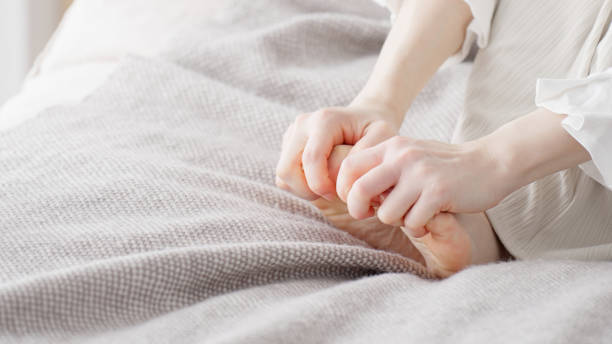 istock A woman rubbing her cold feet 2154845192