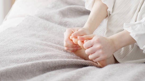 istock A woman rubbing her cold feet 2154845193