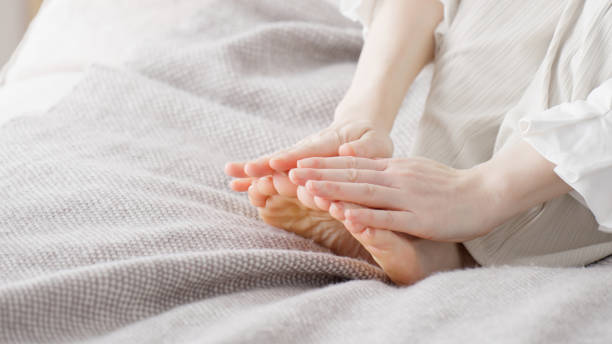 istock A woman rubbing her cold feet 2154845194