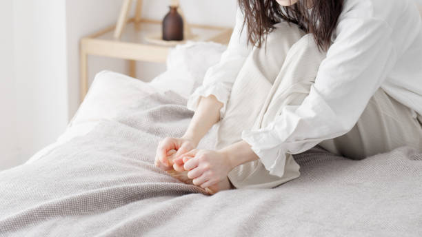 istock A woman rubbing her cold feet 2154845195