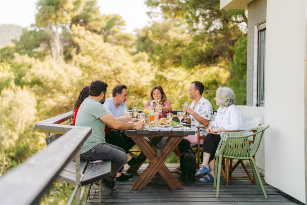 istock Dinner with friends and family on a summer veranda 2154845722