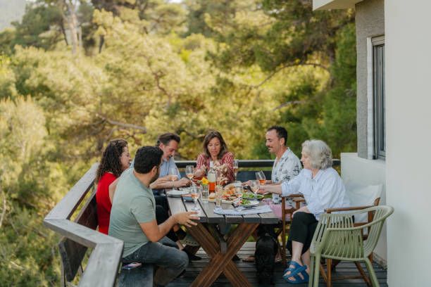 istock Dinner with friends and family on a summer veranda 2154846355