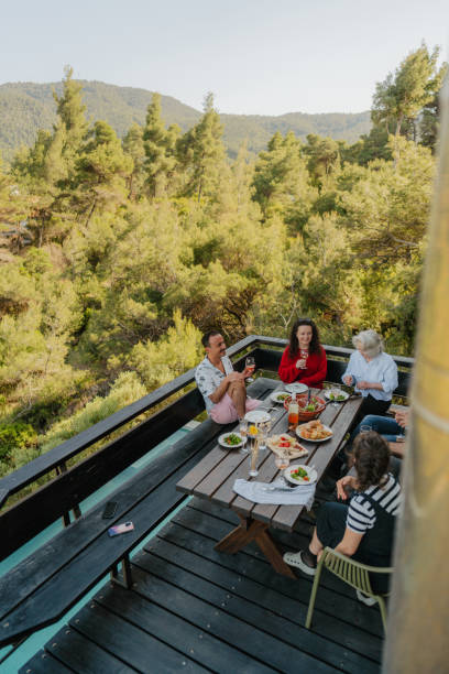 istock Dinner with friends and family on a summer veranda 2154846397