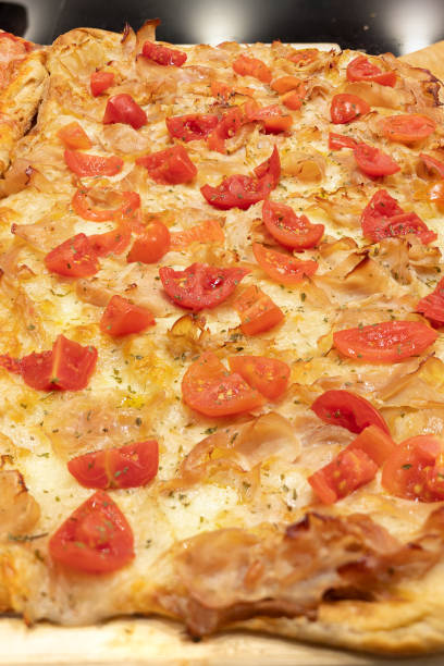 Stuffed Pizza Tray with Fresh Cherry Tomatoes and Sliced Pork.