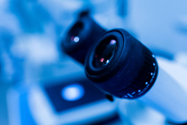 Detailed image of microscope lenses with varying magnifications, showcasing precision equipment used in laboratories for biology, chemistry, and environmental studies.