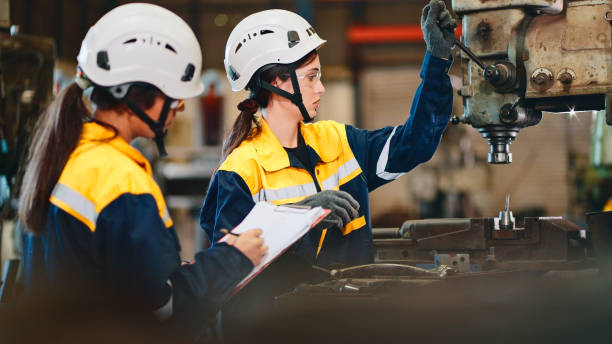 istock Female engineer checking machine in factory. 2154847796