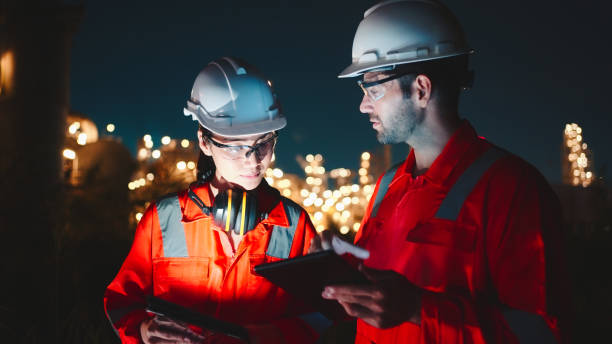 istock Two night shift engineers remotely check the operation of the facilities. 2154847830