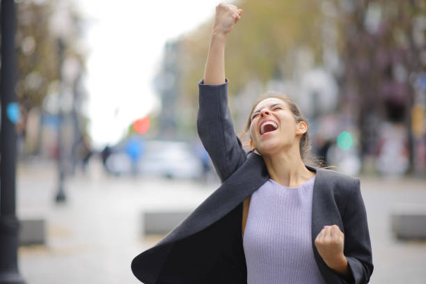 istock Excited executive celebrating in the street 2154848120