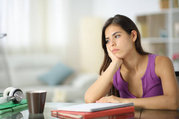istock Apathetic student looking away at home 2154848173