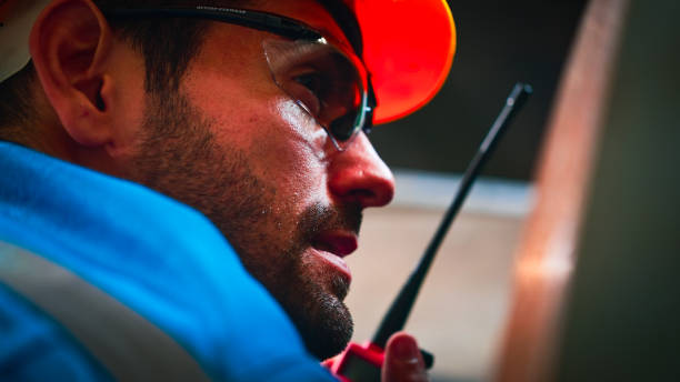 istock Engineer uses walkie talkie in factory. 2154848219
