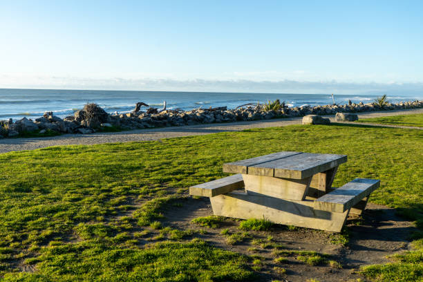 Table and chair near coastal landscape, afternoon