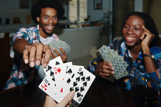 istock Friends Enjoying Playing Cards 2154850638