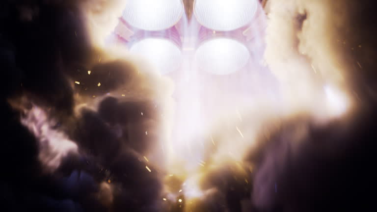 Large Rocket Engine Ignition. Powerful and Hot Flames Burst out of the Nozzle after Initial Impulse. Rocket Launch at Night. Vertical Takeoff of Large Space Exploration Rocket with Boosters.