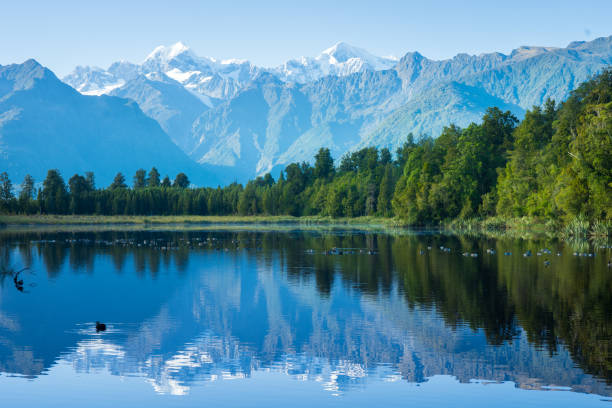 istock Reflection in Lake Matheson, Fox Glacier, New Zealand 2154851489