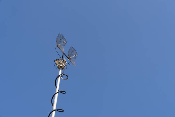 Mobile telecommunication tower on a background of blue sky