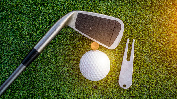 istock Top view of golf equipment on green grass at golf course. 2154855471