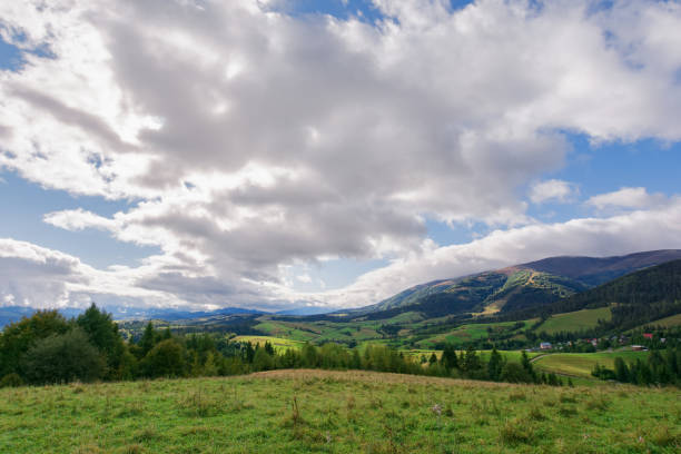 istock alpine countryside scenery with grassy meadows and forested rolling hills in autumn 2154856057