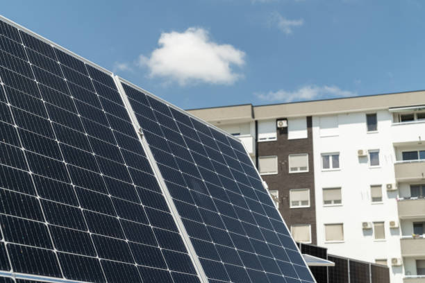 istock Solar panels near an apartment building 2154858329