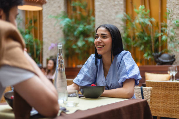 istock Friends Enjoying Meal at a Restaurant 2154858705
