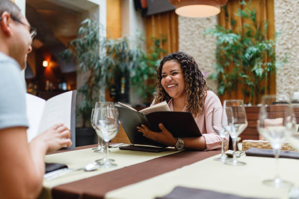 istock Smiling Friends Dining Together at Restaurant 2154858808