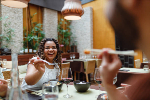 istock Friends Enjoy Dining Together in Restaurant 2154858811