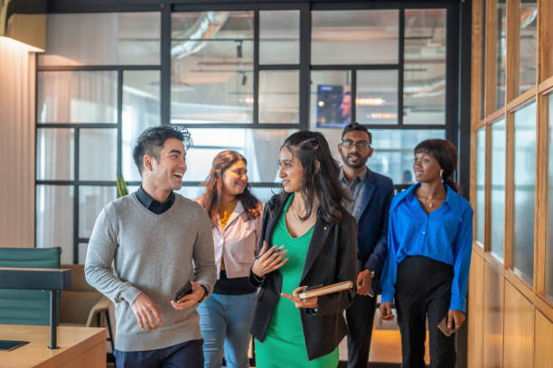 istock Diverse business person walking together in office 2154859794