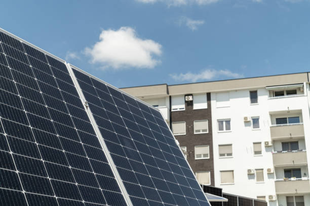 istock Solar panels near an apartment building 2154861859