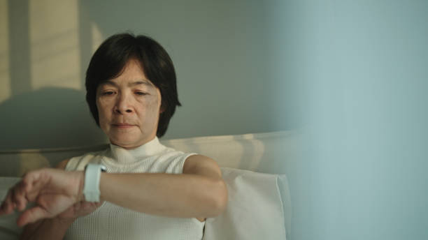 istock Monitor sleep tracking with smart watch in the morning. 2154863514