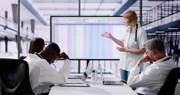 istock Bored Unhappy Doctors At Medical Training Presentation 2154863722
