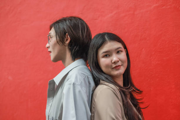 istock Asian couples playfully bond, sharing affectionate gazes, laughter, and intimate warmth outdoors. 2154864895
