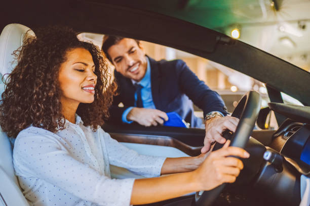 istock Mixed race woman enjoying new car 2154865771