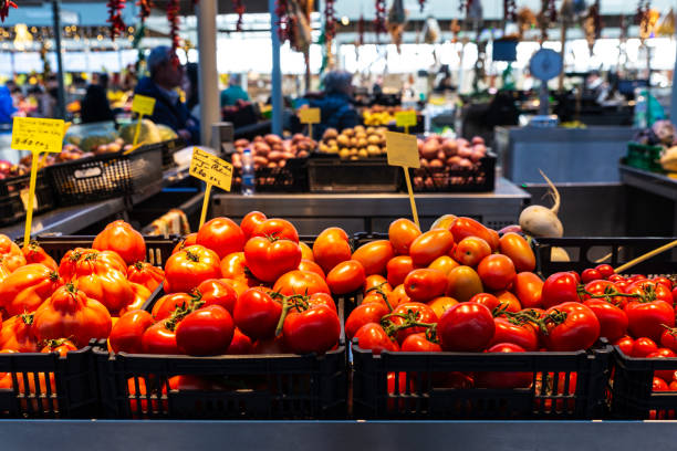 Heap of tomatoes in a fruit and vegetable shop in Bolhao Market, street food market in Porto or Oporto, Portugal