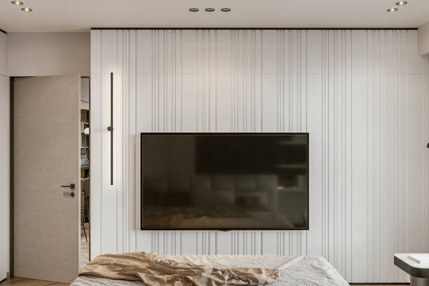 istock Modern bedroom interior with TV on the white texture wall 2154867882