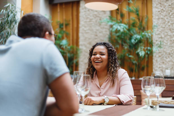 istock Smiling Woman Dining with Friend 2154870267