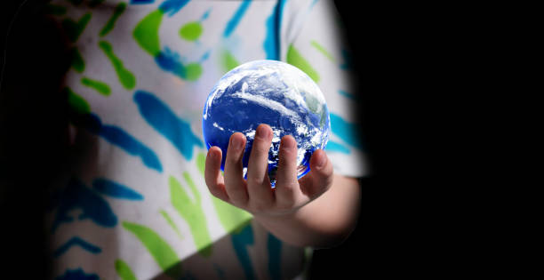istock kid hold planet earth for saving environment world and earth concept (Earth image: http://www.visibleearth.nasa.gov) 2154872579