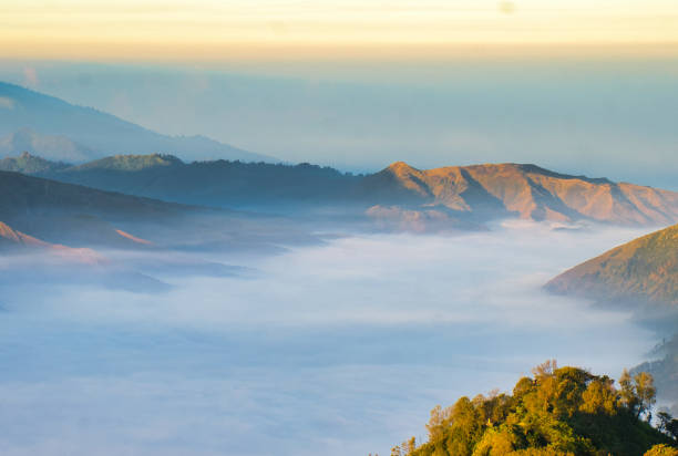 istock Sunrise over mountain range, Tengger Semeru National Park, Mount Bromo, in East Java, Indonesia 2154877150