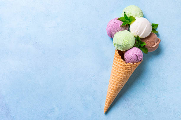istock Ice Cream Scoops in Cone on blue background 2154877380