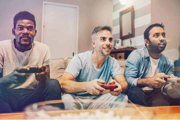 istock three friends playing video games together 2154878090