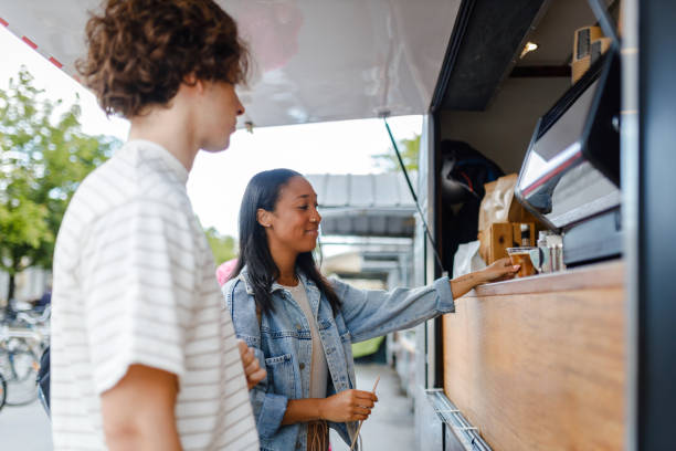 istock Multiethnic Couple Ordering at Outdoor Coffee Stand 2154878145
